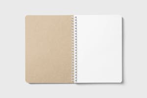 An open spiral-bound notebook with blank pages, ideal for note-taking or design mockups.